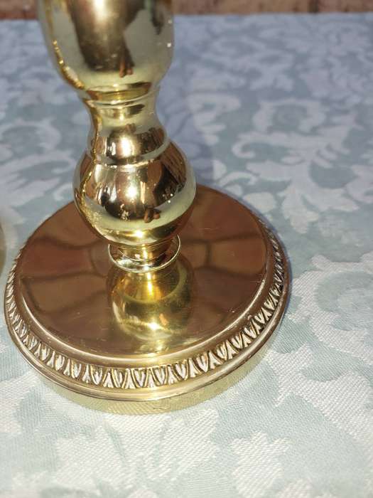 A SET OF BRASS ART DECOR CANDLE STANDS SOLD AS IS