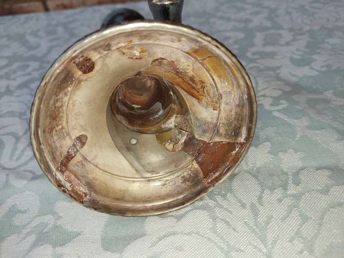A VINTAGE SET OF SILVER PLATED CANDLE STANDS SOLD AS IS