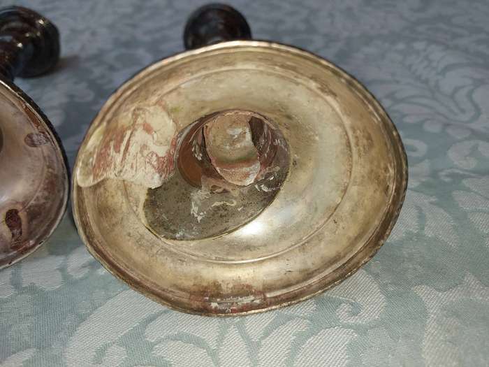 A VINTAGE SET OF SILVER PLATED CANDLE STANDS SOLD AS IS