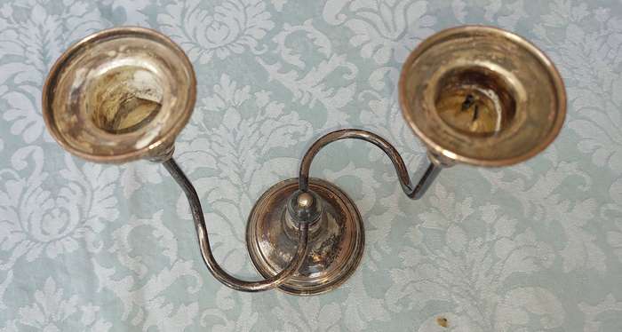 AN ART DECOR VINTAGE CANDLEBRA SOLD AS IS