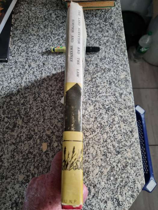 THE LAND SURVEYOR AND THE LAW SIMPSON and SWEENY 1973 ( Please note the condition of the cover )