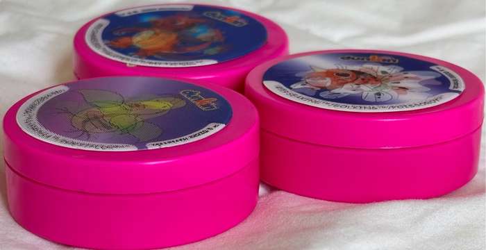 3x Pokémon 1997-2000 Nintendo Dunkin Morphing Tazos on pink containers