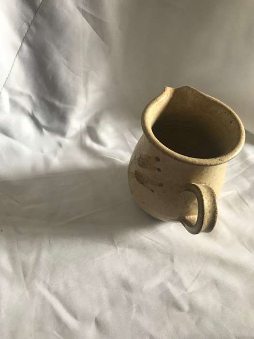 small pottery creamer flower on bothside