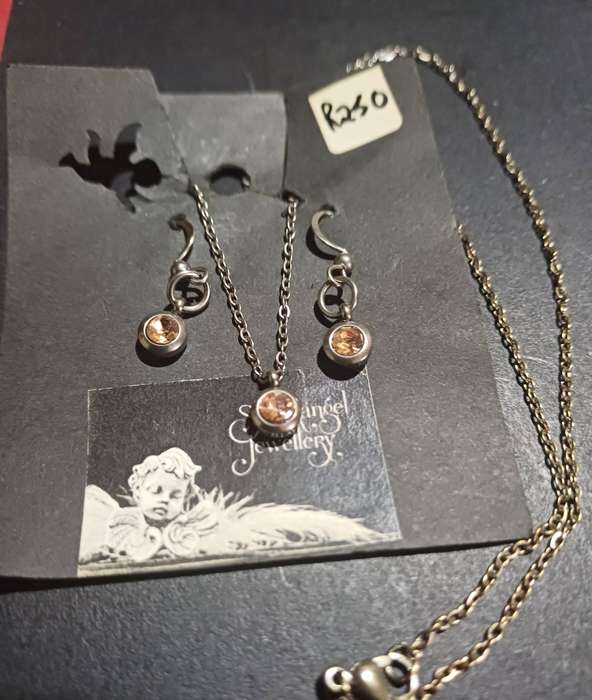 Titanium jewellery set with topaz cz ..earrings and necklace