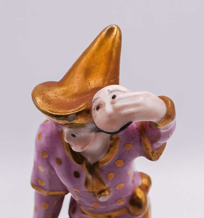 Antique German Porcelain Harlequin Figurine  Hand Painted, Gilt Accents, Holding Mask