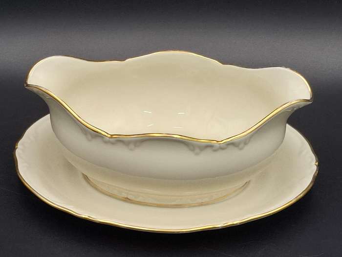 Vintage Porsgrunn Norge - 33 piece dinnerware in ivory with gold trim - designer Nora Gunderson