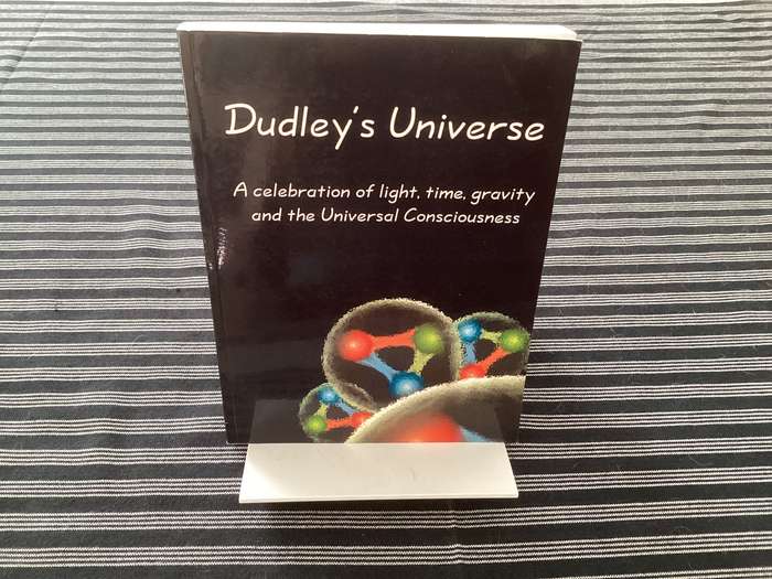 DUDLEYS UNIVERSE, A celebration of light, time, gravity and the universal consciousness. Softcover.