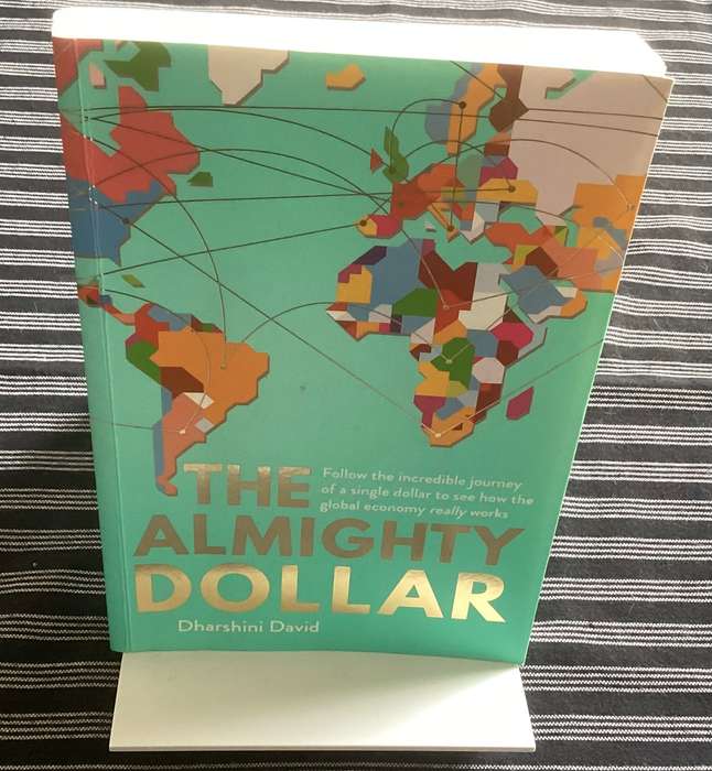 The Almighty Dollar, by Dharshini David. Paperback (trade), in excellent condition.