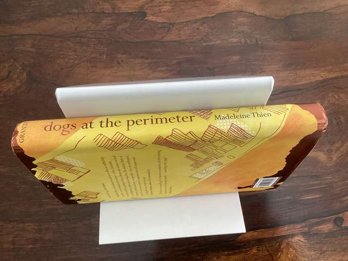 DOGS at the PERIMETER, by Madeleine Thien. Hardcover, in a new condition.