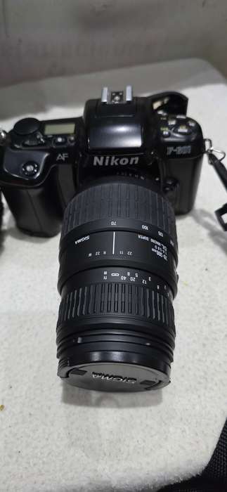 NIKON F601 CAMERA WITH LENS ,CASE AND A SPARE FILM ROLL