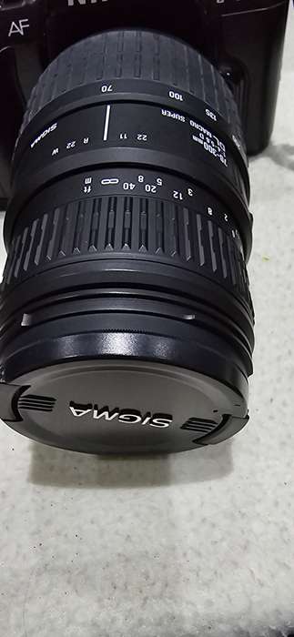 NIKON F601 CAMERA WITH LENS ,CASE AND A SPARE FILM ROLL