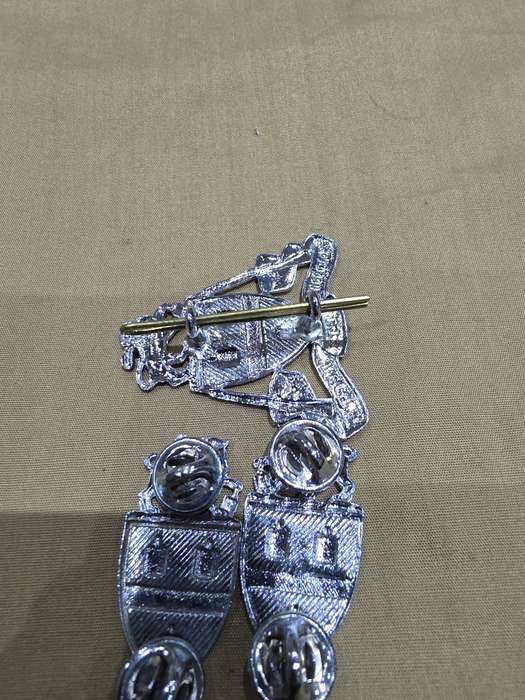 SA ARMY CAP BADGE AND A PAIR OF SHOULDER PINS