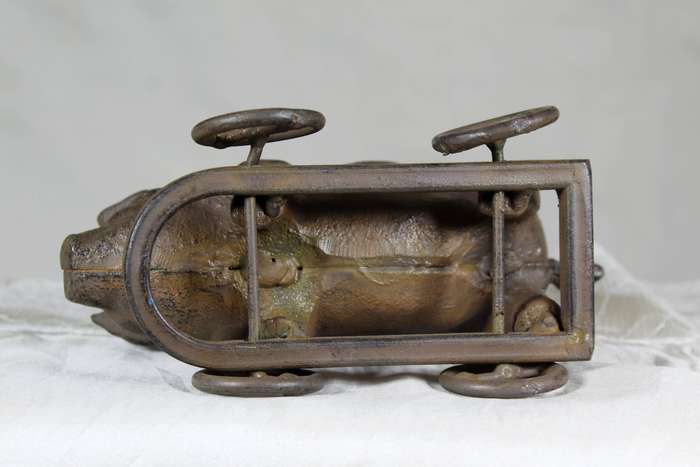 Vintage cast metal pig on wheels