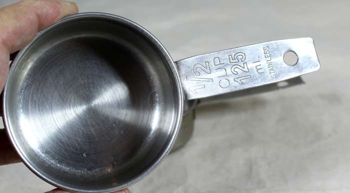 Pair of stainless steel measuring cups