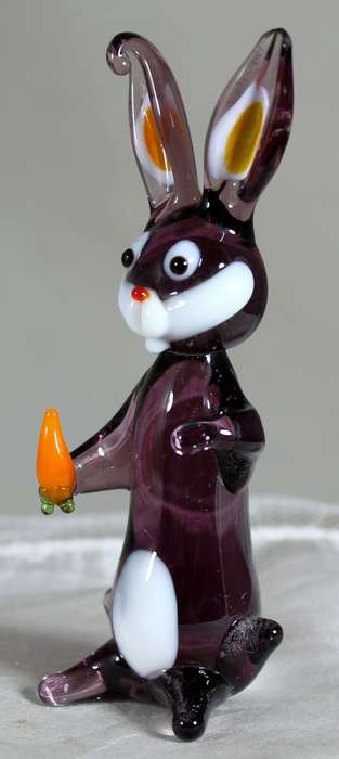 Glass rabbit holding a carrot