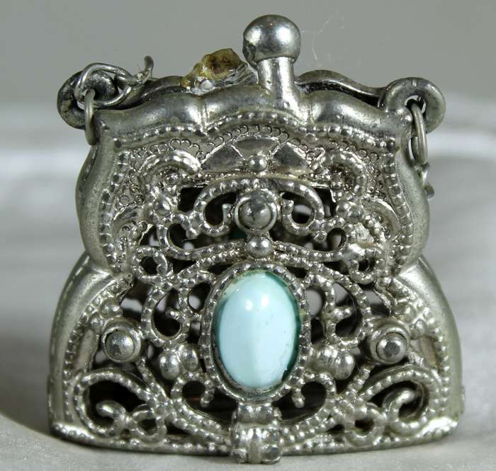 Engraved metal locket with semi-precious stones