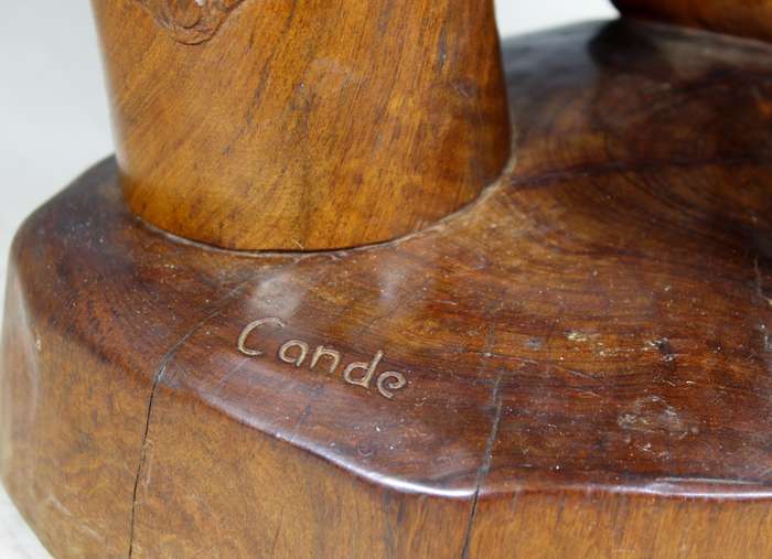 Cande - carved man playing the drums