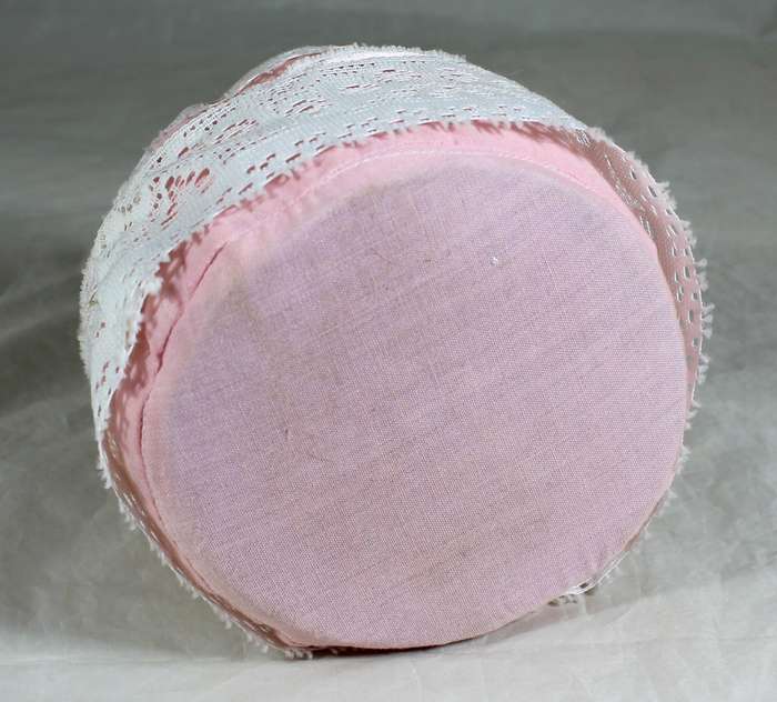Half doll on a tall pin cushion