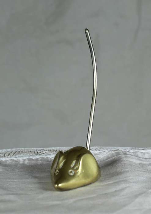 Miniature brass mouse with a tall brass tail