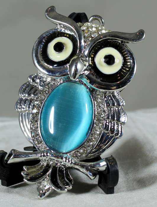Metal owl with semi-precious stone pendant
