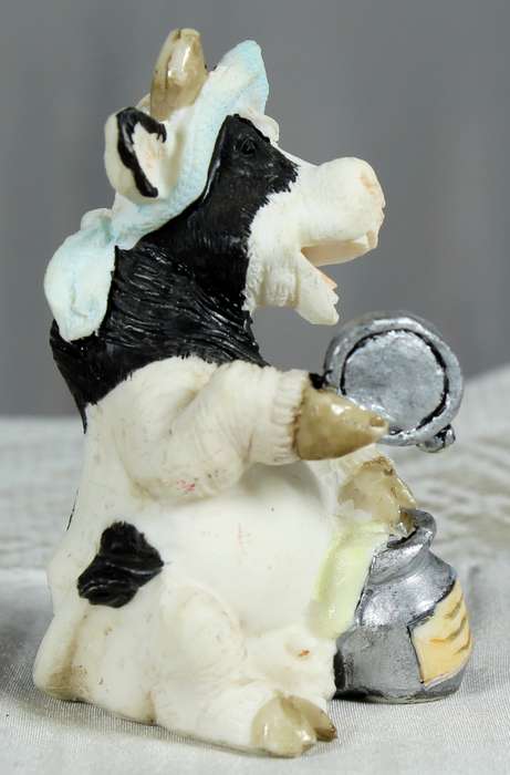 Molded small cow with milk can