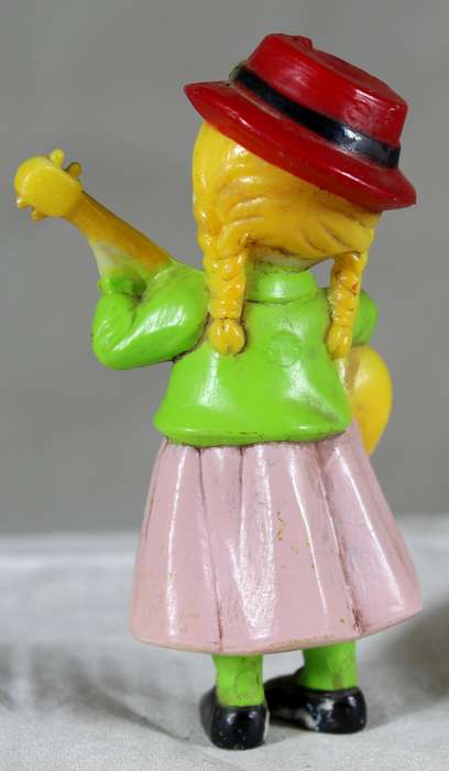 Little girl playing a guitar