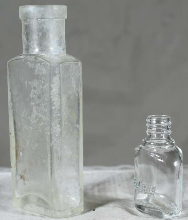 Pair of small vintage glass bottles