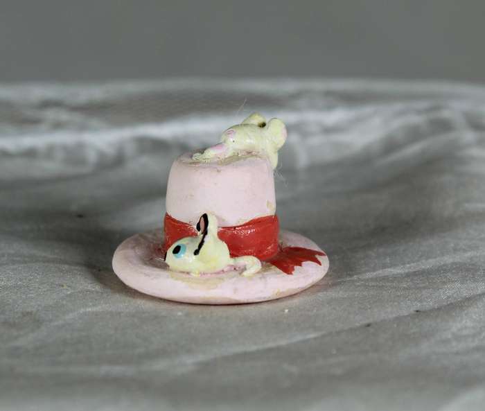 Mini miniature trio of mice on a cake