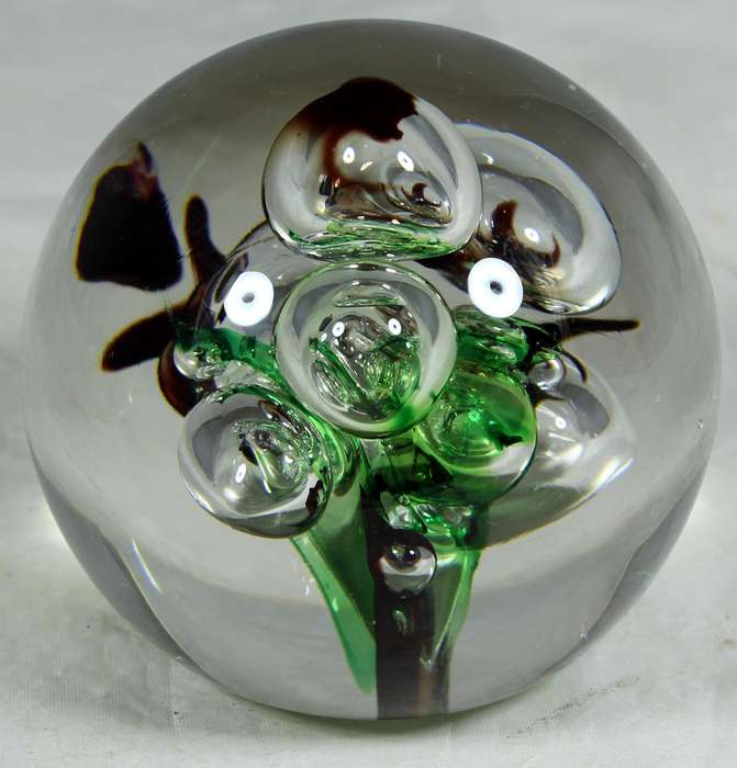 Glass paperweight with colorful bubbles