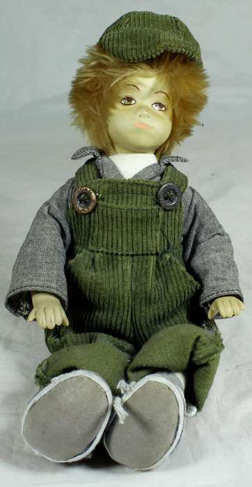 Little porcelain boy dressed in dungaree