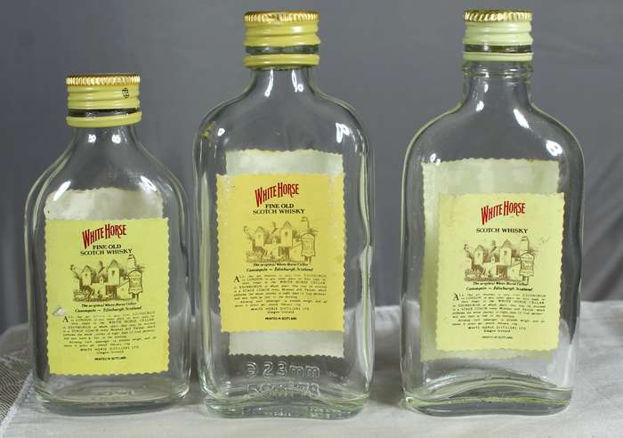 Empty liquor bottles - Trio of White Horse whisky
