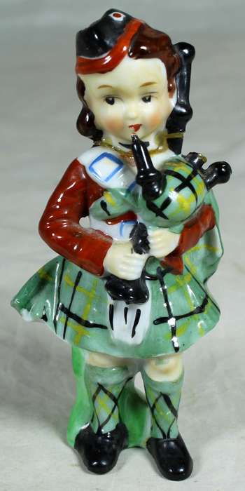 Girl ceramic bagpiper