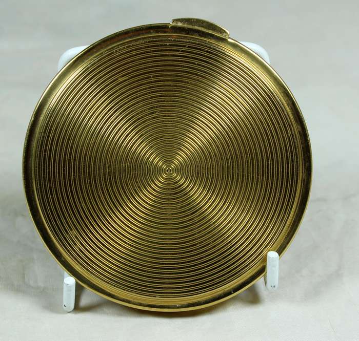 Gold tone powder compact