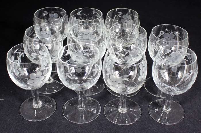 Set of eleven aperitif glasses with etched grapes motif