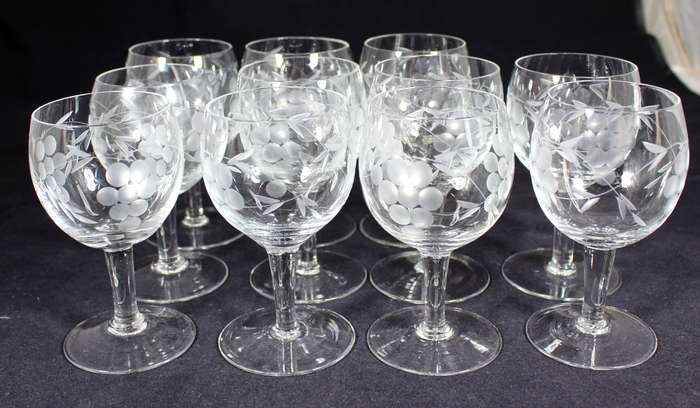 Set of eleven aperitif glasses with etched grapes motif