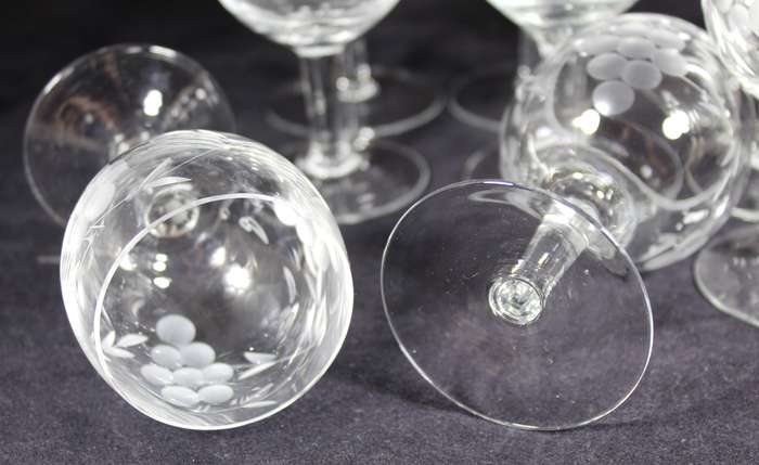 Set of eleven aperitif glasses with etched grapes motif