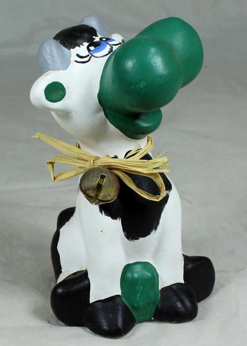 Seated smiling cow