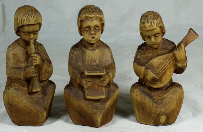 Trio of carved wooden musicians