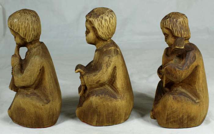 Trio of carved wooden musicians