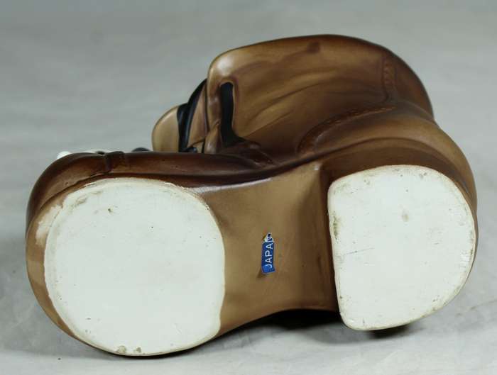 Three puppies on a shoe