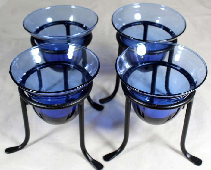Set of four blue vases on stands
