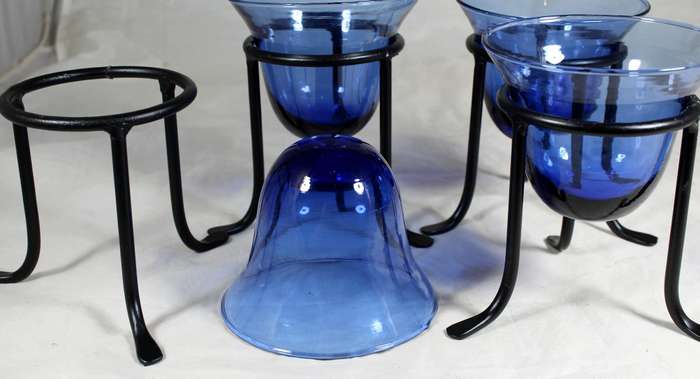 Set of four blue vases on stands