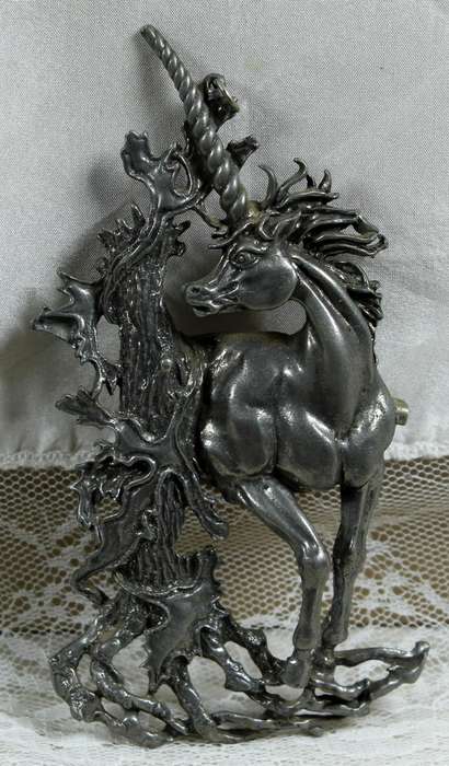 Large metal brooch of a unicorn