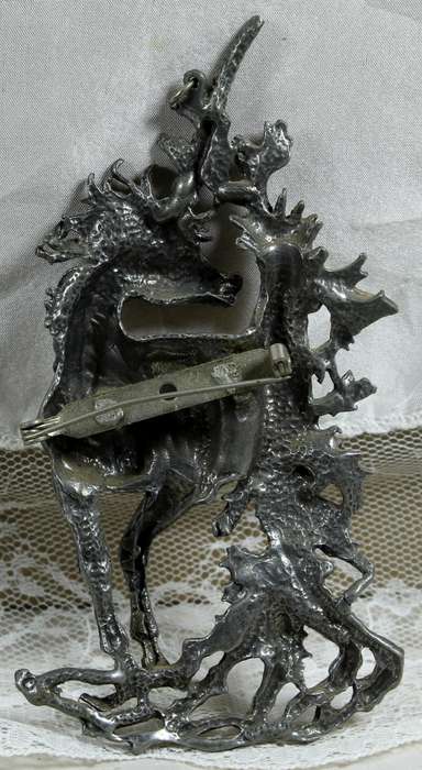 Large metal brooch of a unicorn