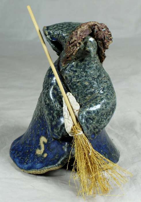 Pottery witch with broom in blue/green coat