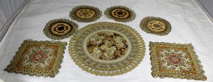 Set of seven ornate place mats