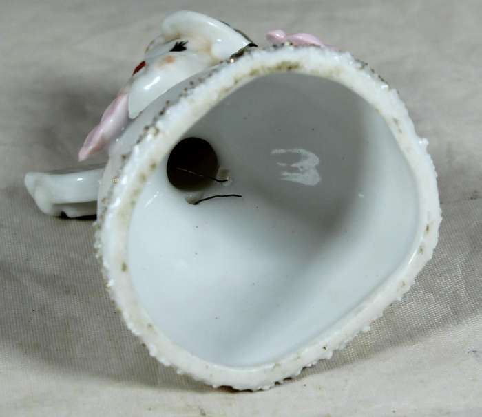 Little girl playing a harp bell