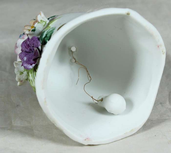 Ceramic bell with embossed flowers