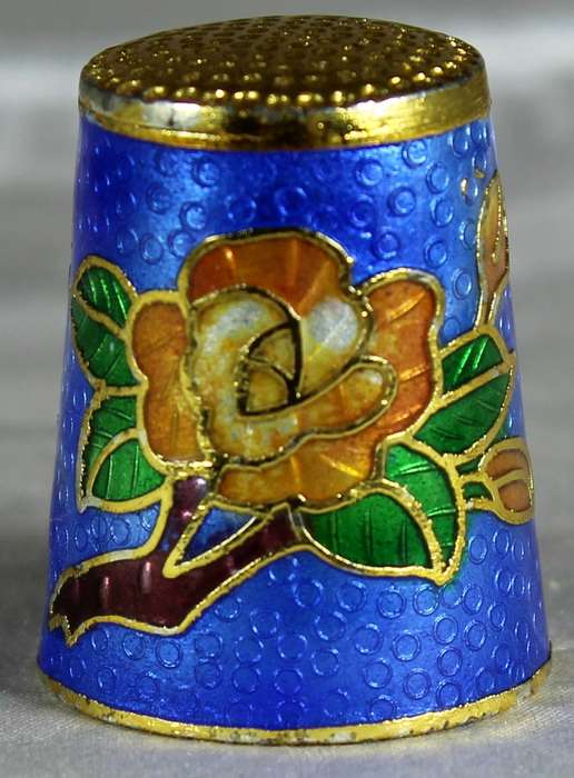 Cloissone thimble - orange flowers on a blue base