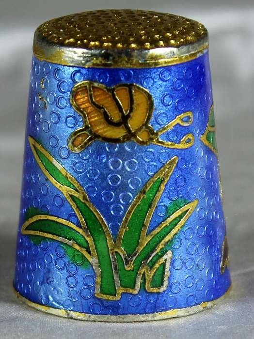 Cloissone thimble - orange flowers on a blue base